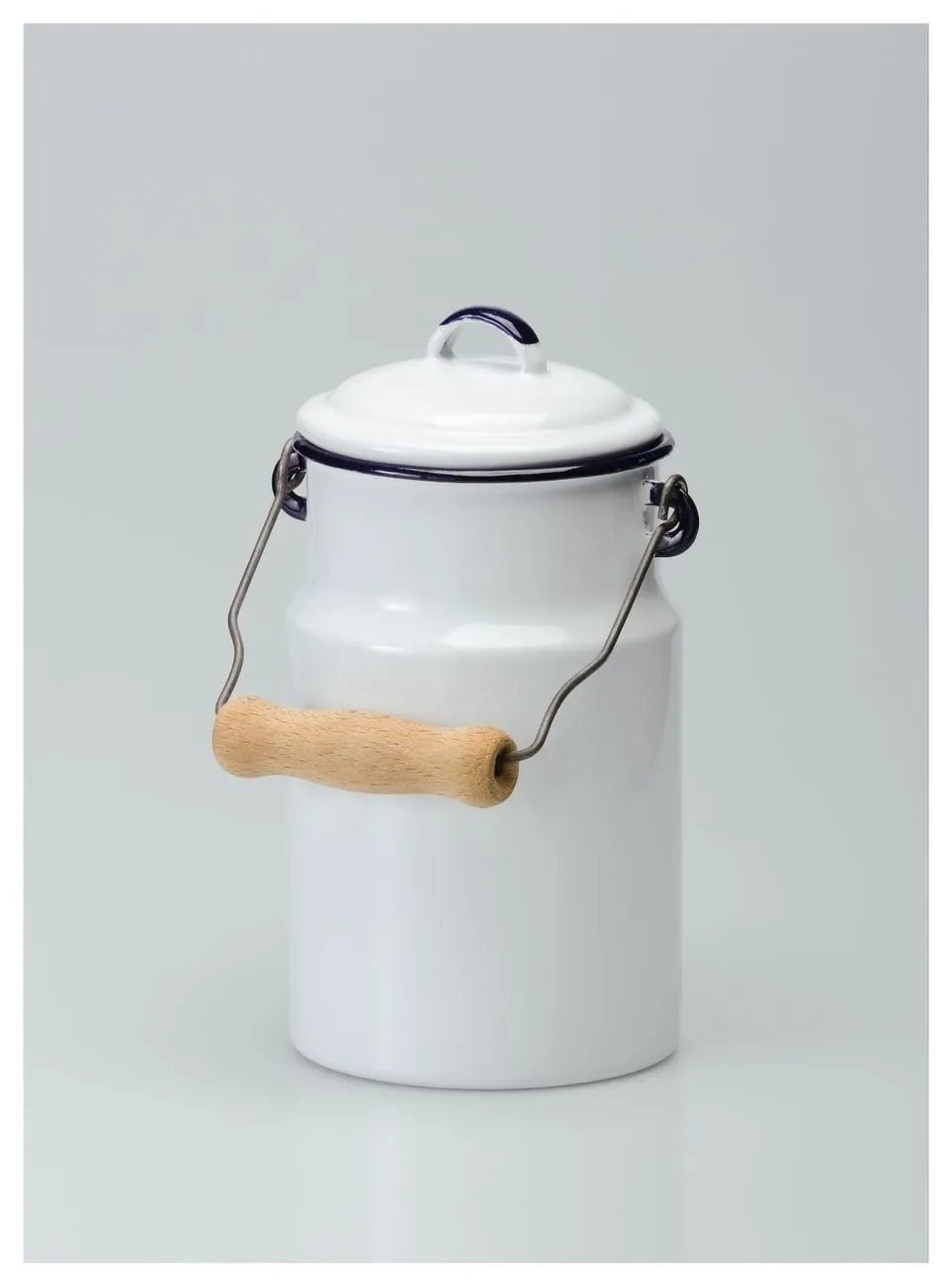 White enamel churn with a lid and a wooden carry handle on a grey background