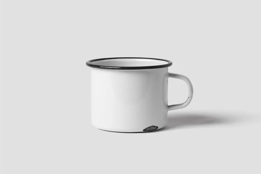 A plain white enamel vessel on a white background