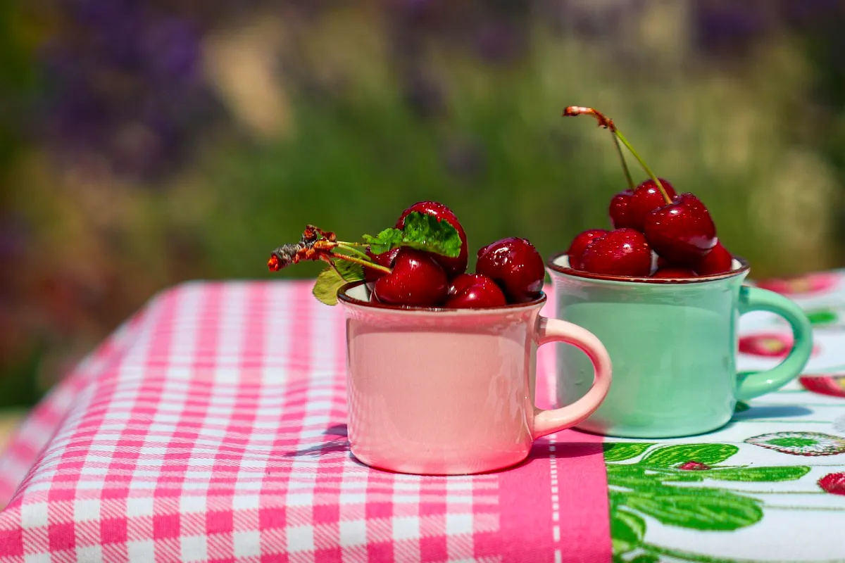 Enamel vessels in pastel colourways with fruit